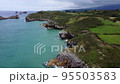 Aerial View of rocky coastline with cliffs and the old ruins of a hermitage 95503583