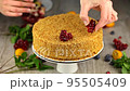 Diet honey cake that does not contain sugar, gluten, decorated with fresh fruits, kumquat, berries and mint leaves 95505409