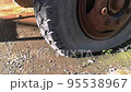 Old cracked and flat tire on a truck close-up. 95538967