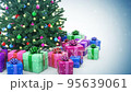 Gift boxes and decorated Christmas tree with sparkling light garland and Christmas baubles 95639061