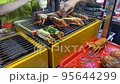 The scene of people cooking grilled lobster with cheese in Ho Thi Ky street food, Ho Chi Minh, Vietnam 95644299