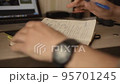 Man makes working entry in his diary 95701245