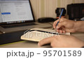 Man makes working entry in his diary 95701589
