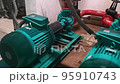 Two large electric pumps on the heating pipe in the boiler room. 95910743
