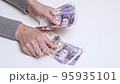 Closeup hands counting UK pounds. Concept Finance Business Investment Success 95935101