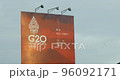 Flying birds behind the big G20 summit billboard in Bali 2022 96092171