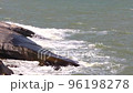 The sea breeze hits the rocks and the currents blow strong. 96198278
