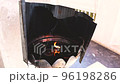 The candle flame on the candle bath melts with the heat. Which is a place to light incense to worship Buddha images in temples of Thailand 96198286