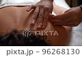 22 Therapeutic massage of the back of the scapula top view close-up 96268130