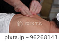 25 Therapeutic back massage from the side close-up slow-motion 96268143