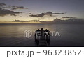 Flying Towards the Sunset on a Drone and Passing by a Wooden Pier Destroyed by a Hurricane in Florida 96323852