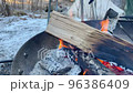 People having a bonfire in the snow 96386409