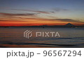 Zushi coast at dusk, orange sky and Mt.Fuji silhouette 96567294