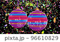 Realistic looping 3D animation of two spinning stylish horizontal colorful lines ornament Christmas baubles against colorful falling confetti rendered in UHD 96610829