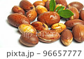 Argan nuts with green leaves motion on an isolated white background. 96657777