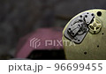 Old vintage clock mechanism working, closeup shot with soft focus. Close up of a internal clock mechanism. Vintage Watch Gears Movement. 96699455