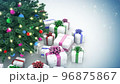 Gift boxes and decorated Christmas tree with sparkling light garland and Christmas baubles 96875867