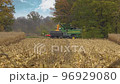 Harvesting machine working in the field. Combine harvester agricultural machine ride in the field of golden ripe corn. 96929080