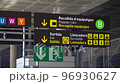 Baggage Claim, Immigration and Gates sign in airport. Spanish symbols. 96930627