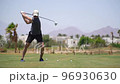 Driving Range Golf. Man practicing with golf club. Slow motion 96930630