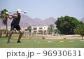 Driving Range Golf. Man practicing with golf club. Slow motion 96930631