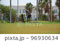 Driving Range Golf. Man practicing with golf club. Slow motion 96930634