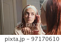 Beautiful woman looking at mirror 97170610