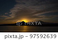 The morning sun rising from the ridgeline of Mt. Koreishan and Mt. Daisen from the mouth of the Hino River in Yonago City, Tottori Prefecture 97592639