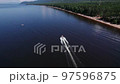 Summertime aerial imagery of Lake Baikal is a rift lake located in southern Siberia, Russia Baikal lake summer landscape view. Drone's Eye View. 97596875