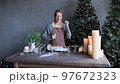 a girl dances in the kitchen while making sweets 97672323