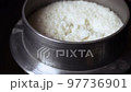 Cook rice in a traditional Japanese pot and put it 97736901