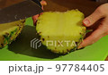 Cut the pineapple 97784405