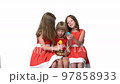 Three kids in red dresses playing with Easter eggs on white background 97858933