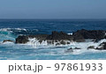 ocean waves hitting rocks at coast, sea at shore 97861933