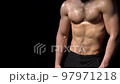 Muscular shirtless man playing with abdominal muscles 97971218