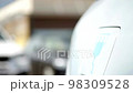 electric powered car in garage as man removes charging cable from vehicle electric car industry future drive modern 98309528