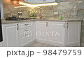 Closeup tilt camera movement at modern classic white kitchen interior 98479759