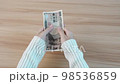 hand counting Japanese Yen banknote. Thousand Yen money. Japan cash, Tax, Recession Economy, Inflation, Investment, finance, savings, salary and payment concepts 98536859