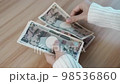 hand counting Japanese Yen banknote. Thousand Yen money. Japan cash, Tax, Recession Economy, Inflation, Investment, finance, savings, salary and payment concepts 98536860