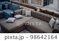 Slow shot filmed in a sofa shop. The comfortable brown sofa with decorative pillows stands out. 4k video 98642164