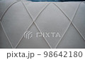 Close-up of a comfortable white sofa with diamond shapes. 4k video 98642180