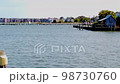 Right To Left Pan of Ocean Town To Reveal a Small Light House 98730760