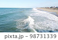 Waves Crashing On The Beach Shoreline 98731339