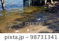Very Calm Water Small Splashing On Rocks And Sand from The Ocean 98731341