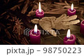Occultist dripping hot wax on voodoo doll, magic rituals, black spell, horror. 98750223