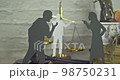 Silhouettes of couples discussing property rights with a mediator. Concept of divorce and discussion. 98750231