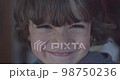 Cinematic close-up of 4-year-old Caucasian boy smiling at 4k camera. Slow Motion. 98750236