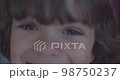 Cinematic close-up of 4-year-old Caucasian boy smiling at 4k camera. Slow Motion. 98750237
