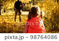 Playful blonde girls in autumn. Autumn Forest or Park. 98764086