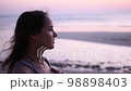 Young pretty woman's face at sunset, outdoor relax 98898403